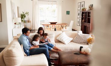 Family relaxing at home while learning about Georgia home insurance deductibles.